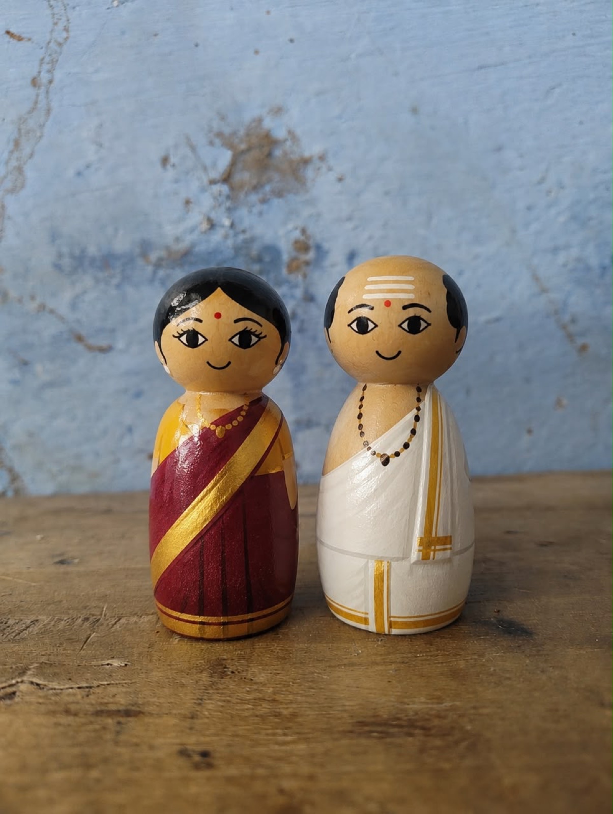 Traditional Channapatna wooden couple in red, white and gold