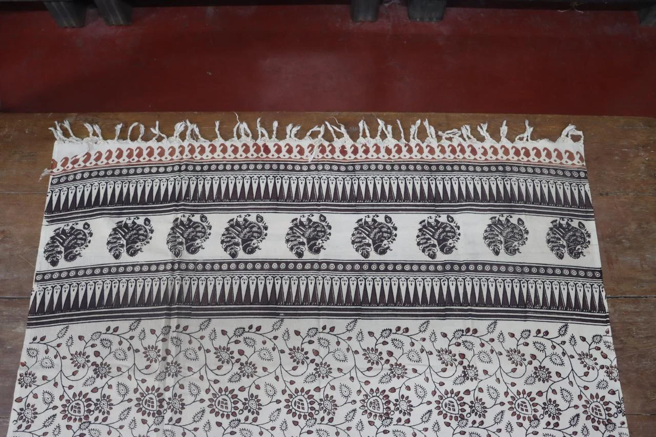 Detailed floral and yali border on Kalamkari printed cotton stole